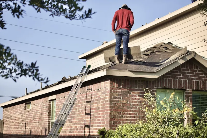 Professional roofer working on a residential roof in North Ironbound